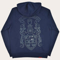 A navy blue hooded sweatshirt shown from the back, featuring a large, tonal gray graphic of a medieval crest with the text 'EX CORTE CARITAS' on a banner above it.