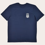 A navy blue short-sleeve crewneck t-shirt with a small white crest graphic printed on the left chest, displayed on a solid white background.