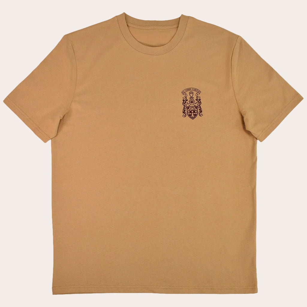 A tan short-sleeve crewneck t-shirt with a small dark brown graphic on the left chest, displayed flat against a solid white background.