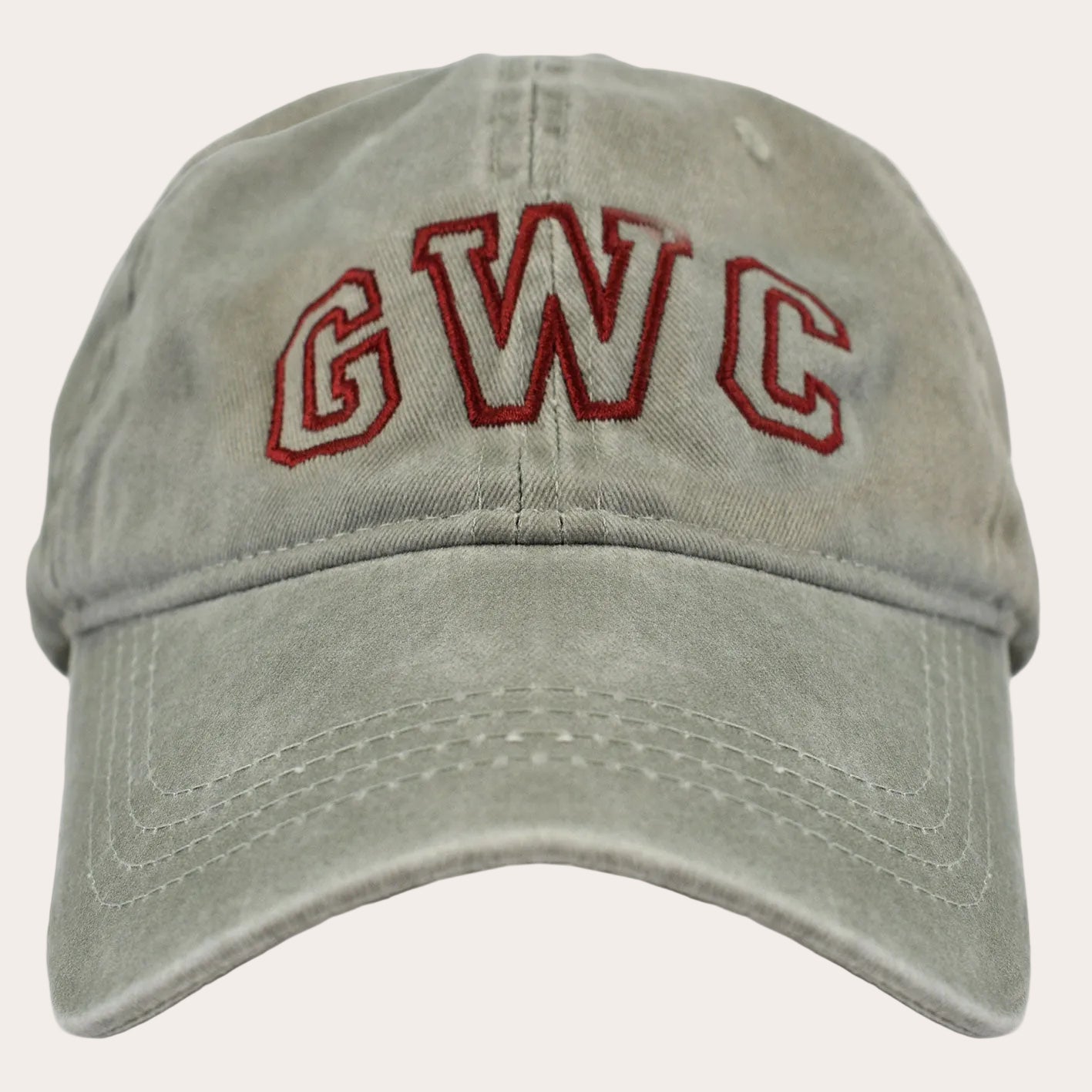 A washed light gray baseball cap featuring 'GWC' embroidered in red arched block letters on the front, shown against a plain white background.