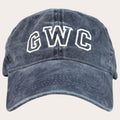 A washed navy blue baseball cap with 'GWC' embroidered in white varsity-style block letters on the front, shown against a plain white background.