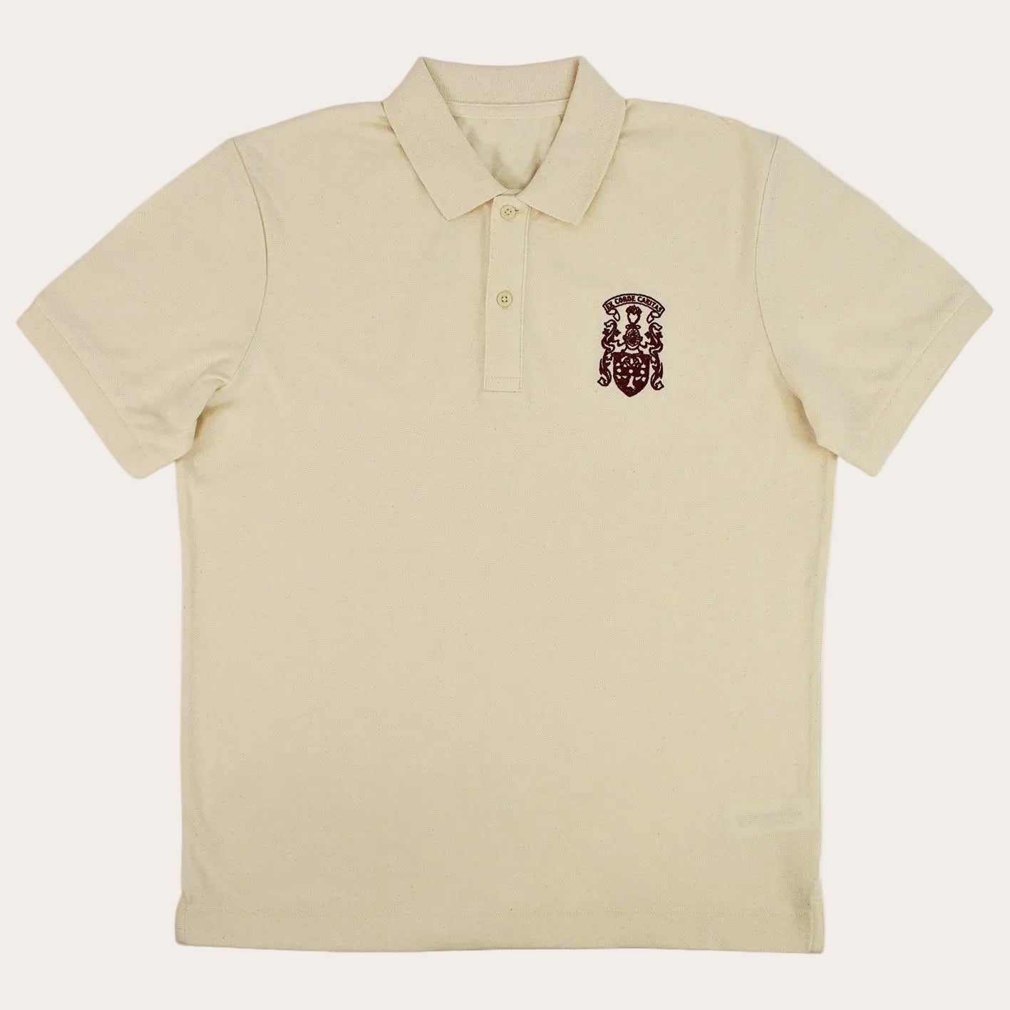 A cream-colored short-sleeve polo shirt with a small embroidered crest on the left chest, displayed flat against a white background.